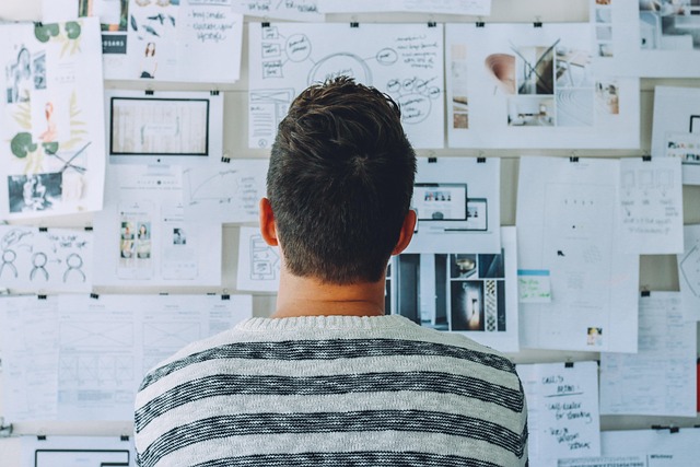 student reviewing IT course notes and planning study schedule in the UK